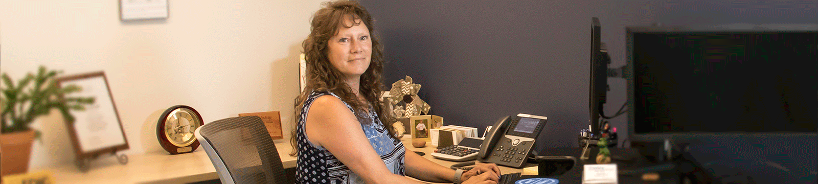 Friendship State Bank branch manager at a desk ready to answer your questions about deposit accounts.