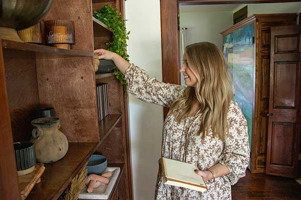 Local interior designer making notes and looking at decor options.