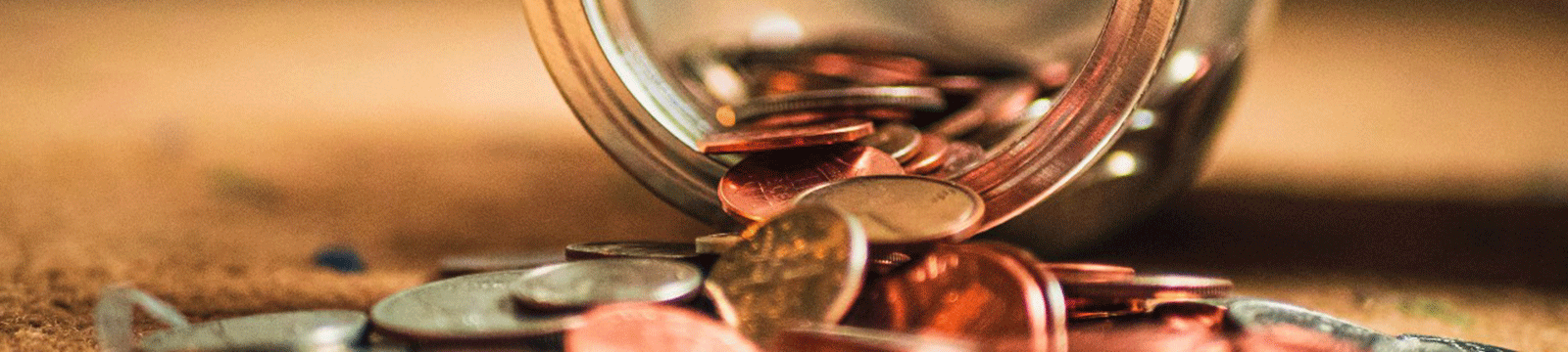 Coin spilling from a jar.