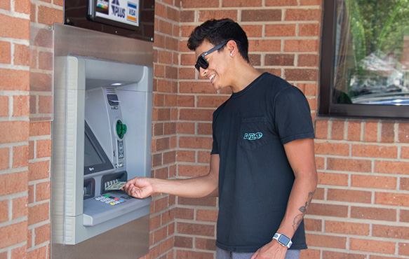 Man using ATM