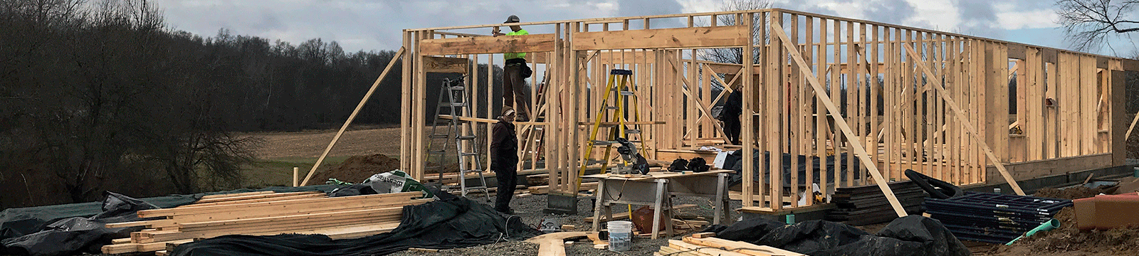 Workers construction the frame of a new home.